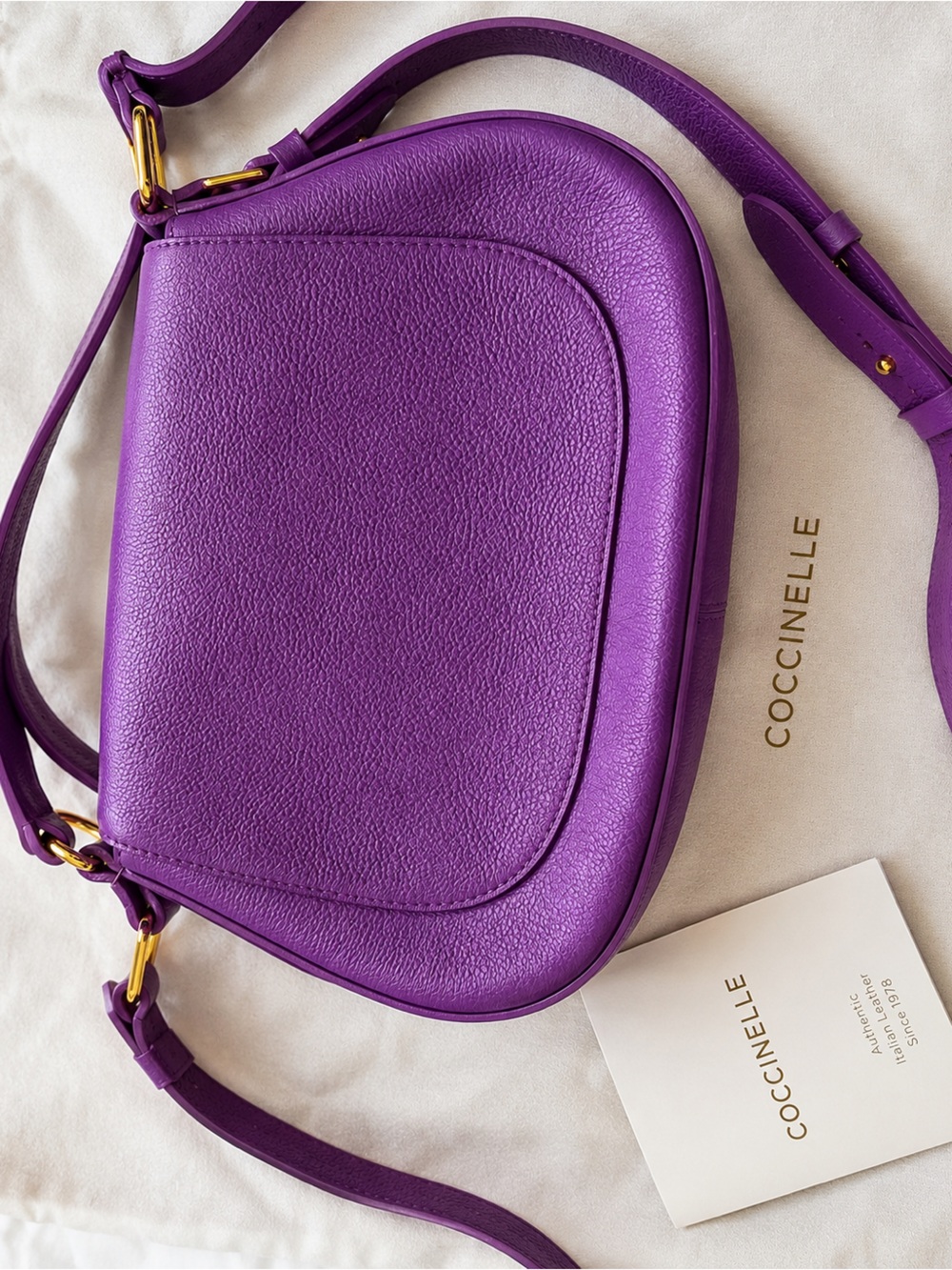COCCINELLE Orchid Purple Leather Saddle Bag Crossbody Gold Hardware Italy. NWOT